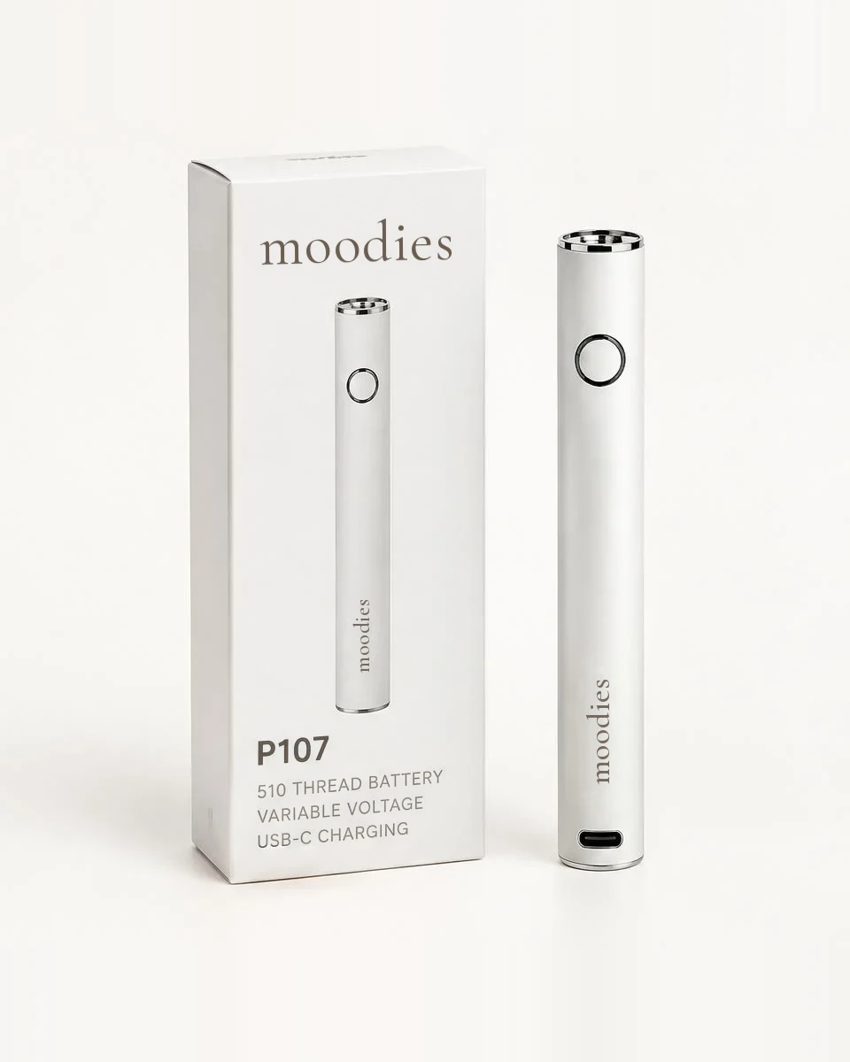 Moodies P107 510 thread push battery in pearl white beside its white Moodies box
