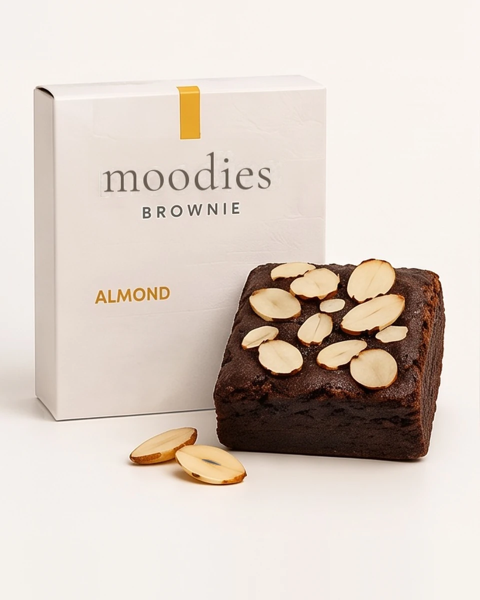 Moodies uplifted almond brownie in its Moodies packaging