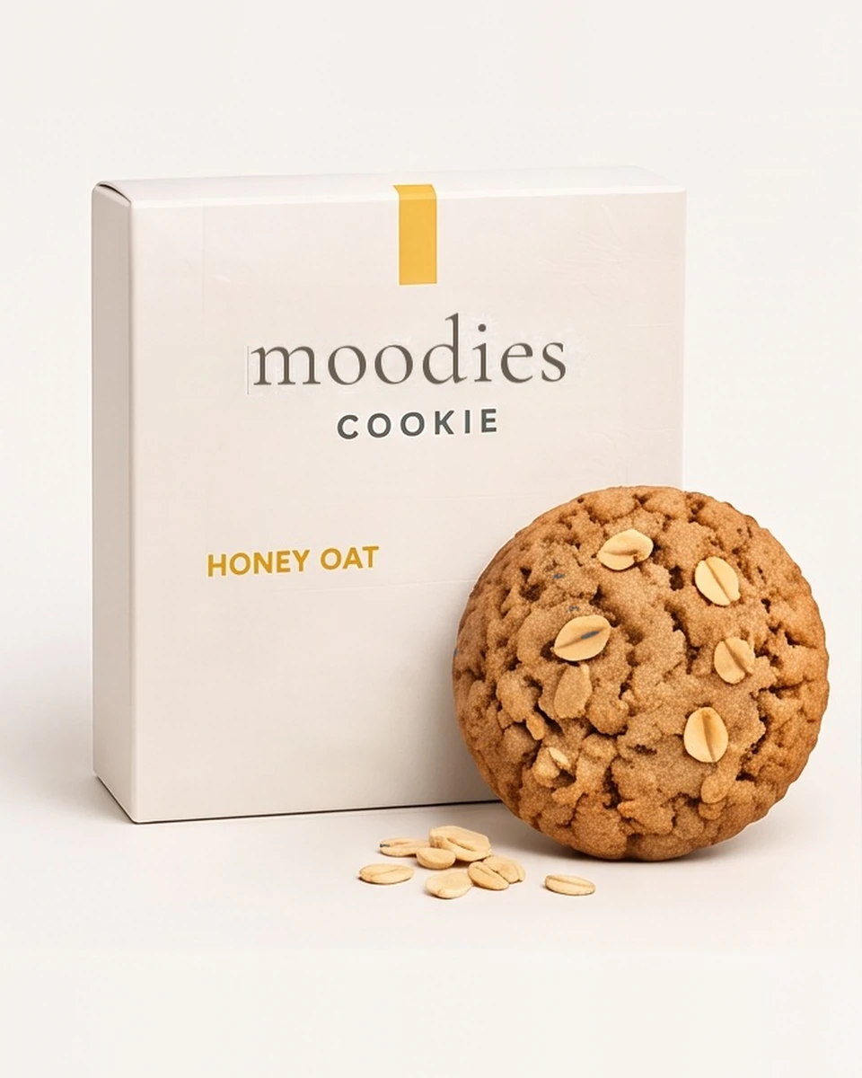 Moodies uplifted honey oat cookie in its Moodies packaging